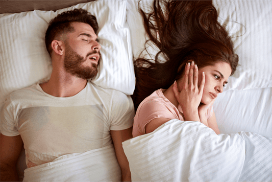 "Snuggle, Snore, Repeat: Surviving the Symphony of Sleep with a Snorer"